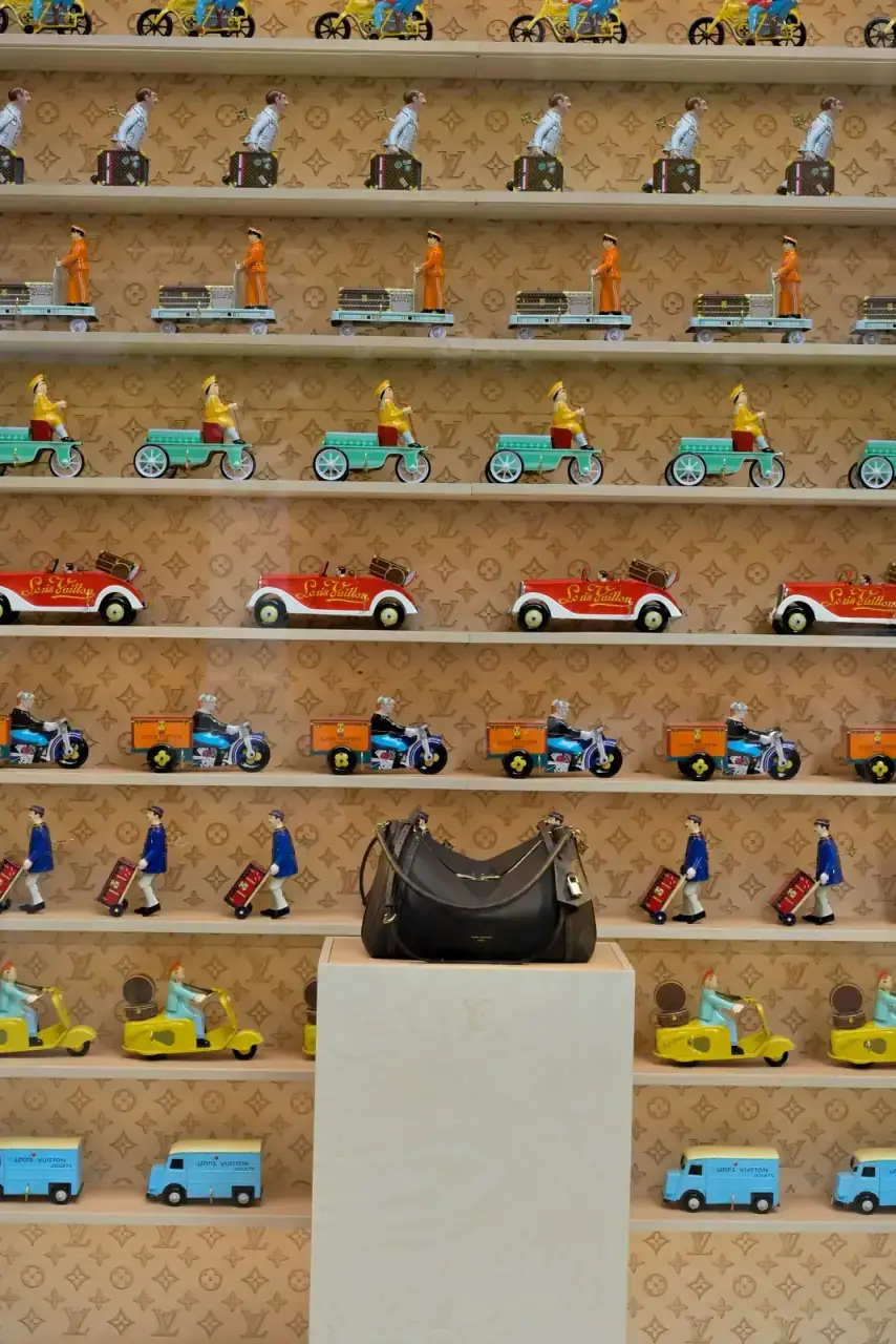 Louis Vuitton handbag on a plinth in a boutique window display